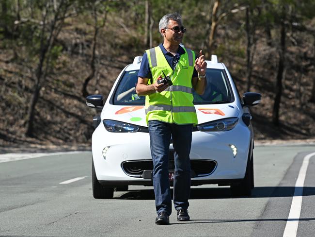 Amit Trivedi walks into the path of self-driving car prototype Zoe2 during testing in Brisbane. Picture: Lyndon Mechielsen