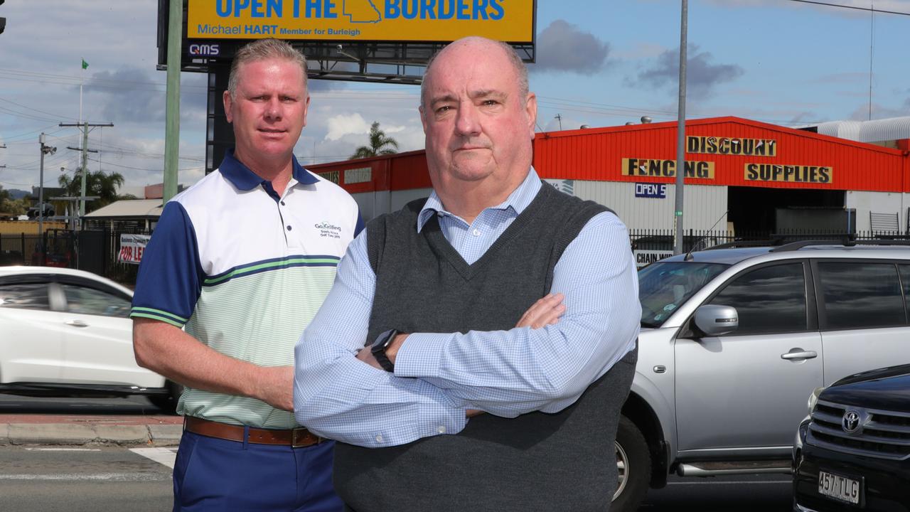 Michael Hart MP unveils a new Gold Coast billboard campaign to urge the government to reopen the borders. Picture Glenn Hampson