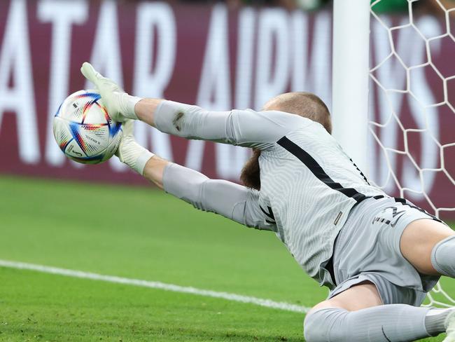 Andrew Redmayne’s penalty save was pivotal to rebuilding the Socceroos’ brand. Picture: Matthew Ashton/AMA/Getty Images