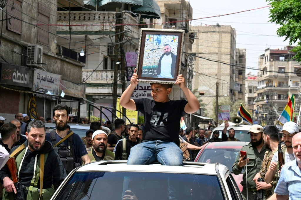 Syria’s Druze take up arms to defend their town against Islamists