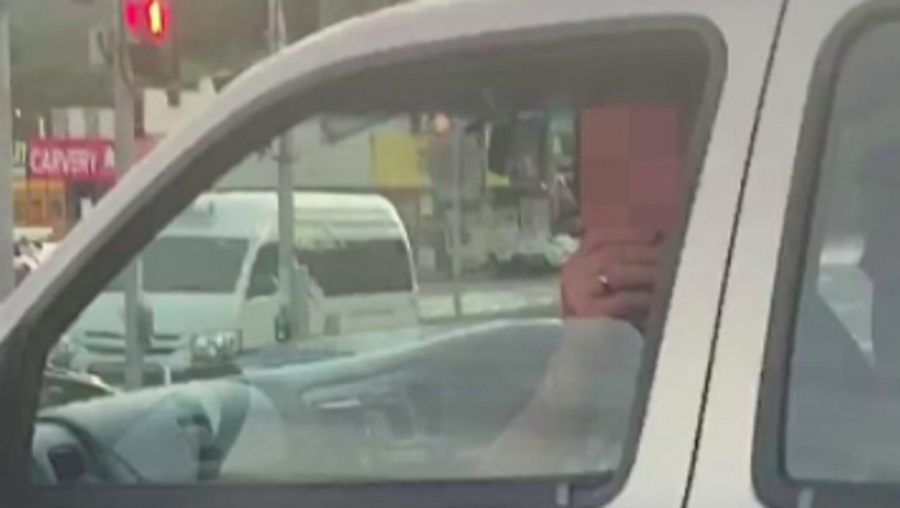 A passenger at a set of traffic lights in Cairns has taunted a South Korean man with fake coughs and sneezes. Picture: Facebook