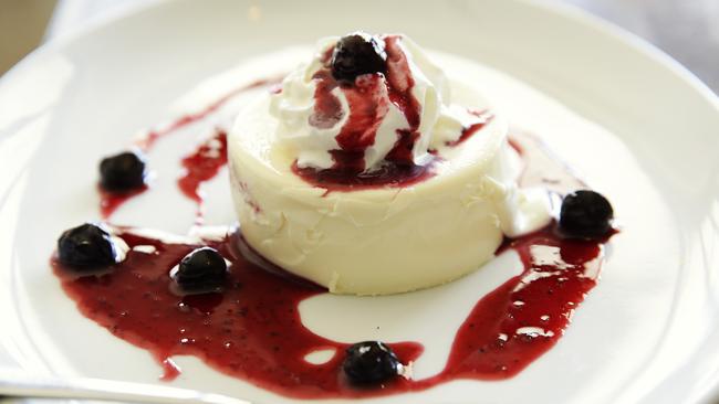 Keep it sweet: Pannacotta with wild berry sauce. Picture: Braden Fastier