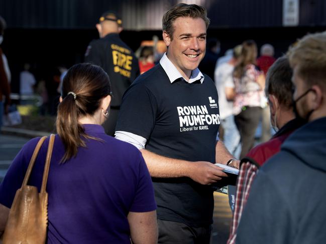 Failed Liberal candidate for the Hills seat of Kavel, Rowan Mumford, handing out how to vote cards at Mount Barker High School. Picture: Naomi Jellicoe