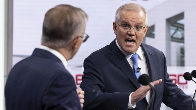 SYDNEY, AUSTRALIA - MAY 08: (L-R) Australian opposition leader Anthony Albanese and Australian Prime Minister Scott Morrison debate on live television ahead of the federal election, during the second leaders' debate of the 2022 federal election campaign at the Nine studio on May 8, 2022 in Sydney, Australia. The Australian federal election will be held on Saturday 21 May with Liberal leader Scott Morrison looking to secure a fourth term in power for the Coalition against Labor and opposition leader Anthony Albanese. (Photo by Alex Ellinghausen - Pool/Getty Images)