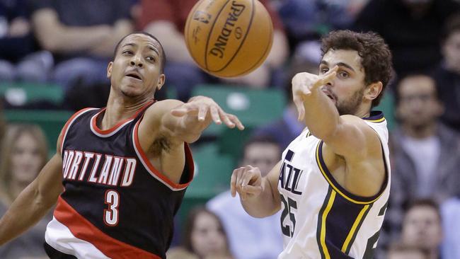 Utah Jazz guard Raul Neto, right, right passes the ball as Portland Trail Blazers guard C.J. McCollum.