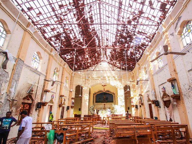 Sri Lankan officials inspect St. Sebastian's Church in Negombo, north of Colombo, after multiple explosions targeting churches and hotels. Picture: Getty