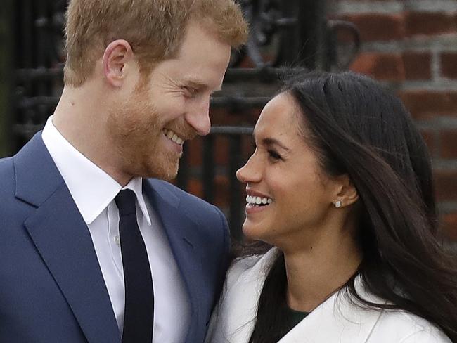 Britain's Prince Harry and his fiancee Meghan Markle. Picture: AP Photo/Matt Dunham