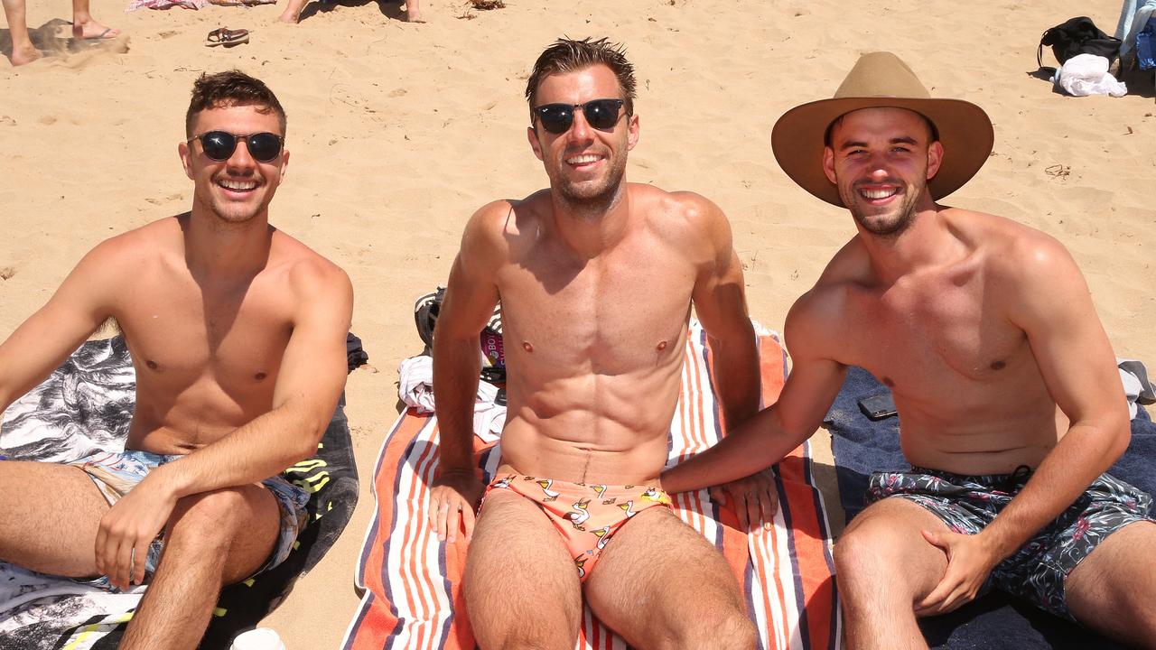 Paul Lo Presti and brothers Marcus and Nicholas De Leur enjoy a summers day at the beach in Lorne. Picture: Alison Wynd