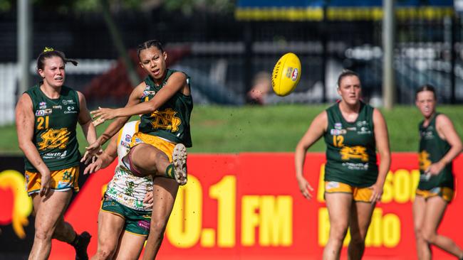 Lexie Cagney kicks in the 2023-24 NTFL Women's Grand Final between PINT and St Mary's. Picture: Pema Tamang Pakhrin