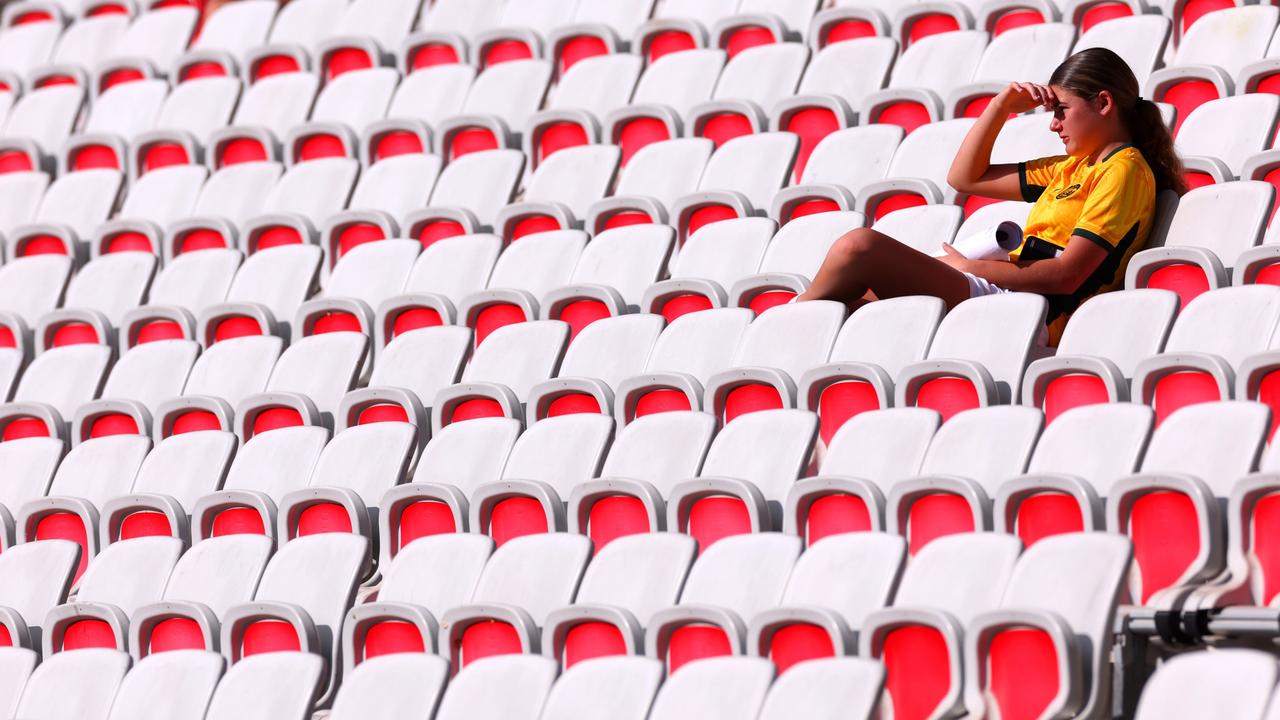 A fan looks on from the stands at the group B match between Australia and Zambia during the Olympic Games. (Photo by Marc Atkins/Getty Images)