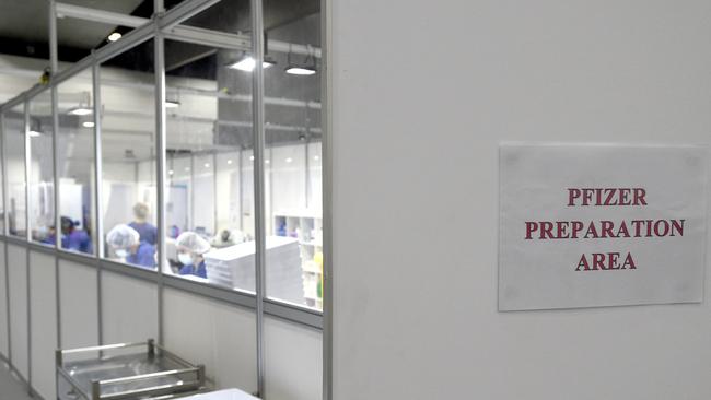 Medical staff at the Melbourne Convention and Exhibition Centre prepare to administer Covid vaccinations on Friday. Picture: NCA NewsWire / Andrew Henshaw