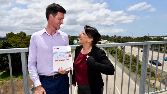 Queensland Minister for Energy, Biofuels and Water Supply, Mark Bailey (left) says Labor helped to stabilise power bills. (AAP Image/Darren England)