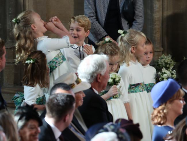 Princess Charlotte of Cambridge, Savannah Phillips and Prince George entertain themselves before the ceremony. Picture: AFP