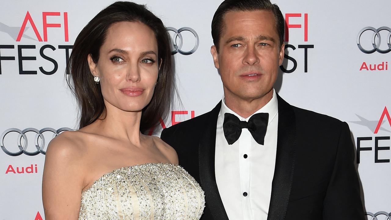 The scam used Pitt’s divorce from Angelina Jolie as a reason he needed money. (Photo by MARK RALSTON / AFP)