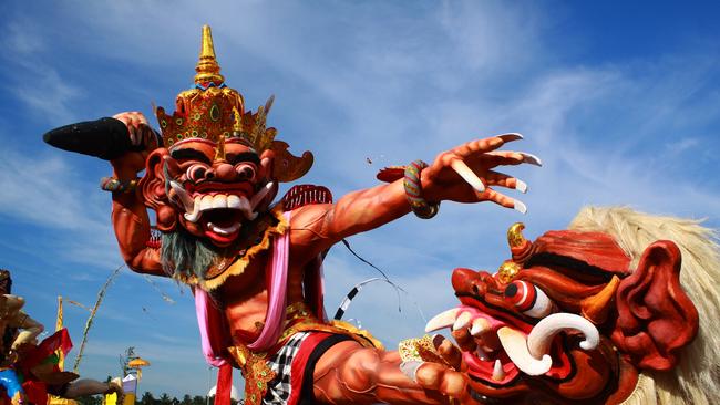 A papier-mache effigy called an ogoh-ogoh in a Balinese parade before Nyepi day.