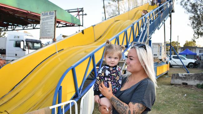 River and Chloe Teske before they went down the huge slide at the Gatton Showgrounds, during the 2023 Lights On The Hill memorial event.