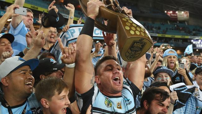 Chris Heighington celebrates with the crowd after the Sharks 2016 grand final win.