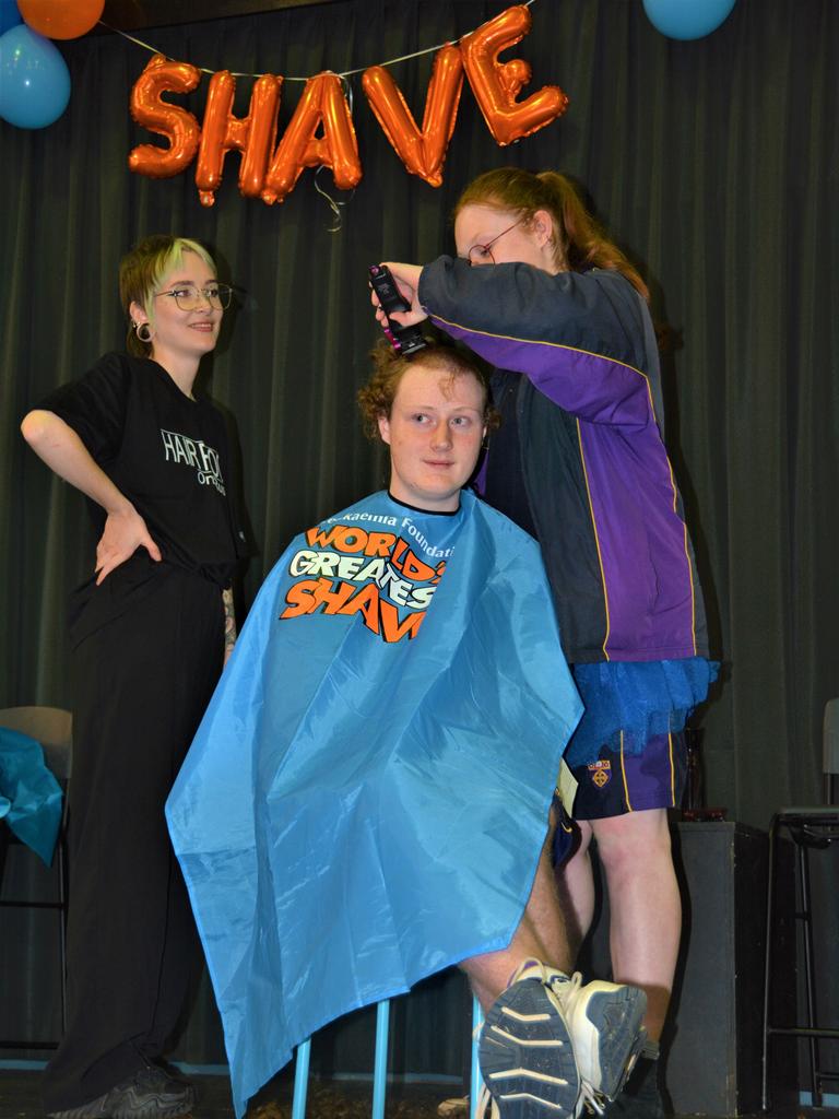 At the St Joseph's College 2023 World's Greatest Shave event is Angus Deacon getting his hair cut by Caitlin Symes from the Hair Room on Russell. Picture: Rhylea Millar