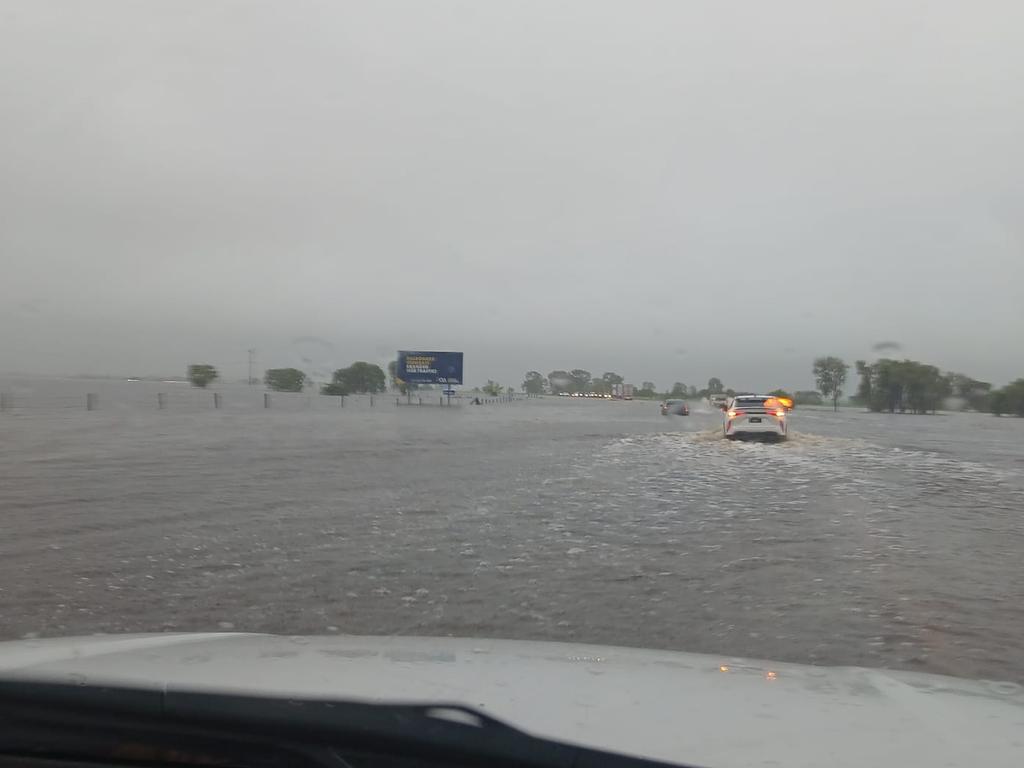 The Bruce Highway has flooded in the Whitsundays, with cars stopped in floodwaters near Goorganga. Photo: CJ Magee