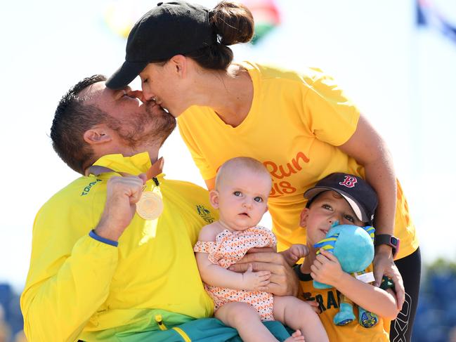 GOLD COAST, AUSTRALIA - APRIL 15:  Gold medalist Kurt Fearnley of Australia celebrates with wife Sheridan, son Harry and daughter Emilia during the medal ceremony for the MenÂ’s T54 marathon on day 11 of the Gold Coast 2018 Commonwealth Games at Southport Broadwater Parklands on April 15, 2018 on the Gold Coast, Australia.  (Photo by Matt Roberts/Getty Images)