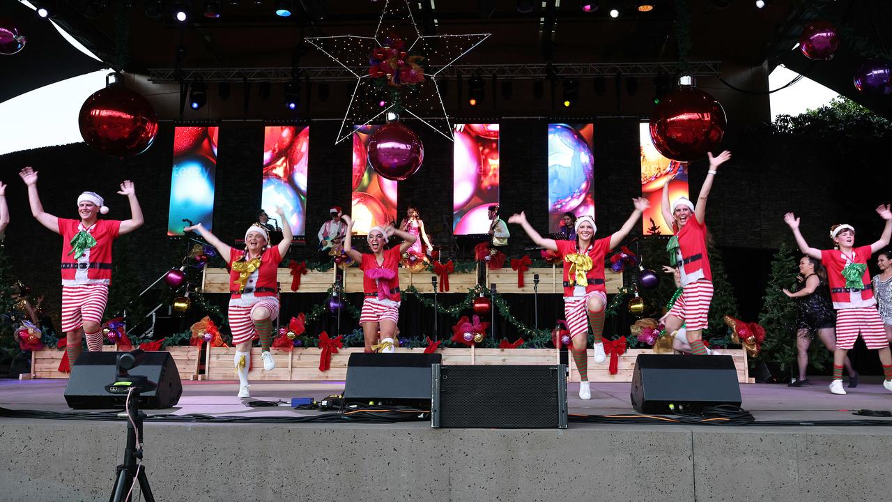 Naughty elves dance on stage at the Carols in the Park, held at Munro Martin Parklands. Picture: Brendan Radke