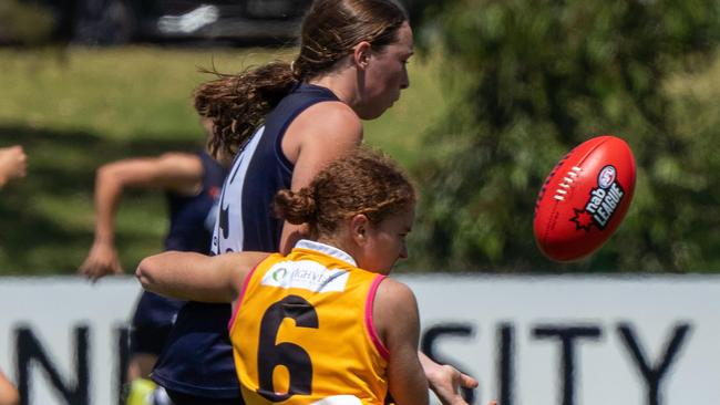 Amber Clarke lays a tackle for the Stingrays against Geelong Falcons. Pic: Jazz Bennett Media