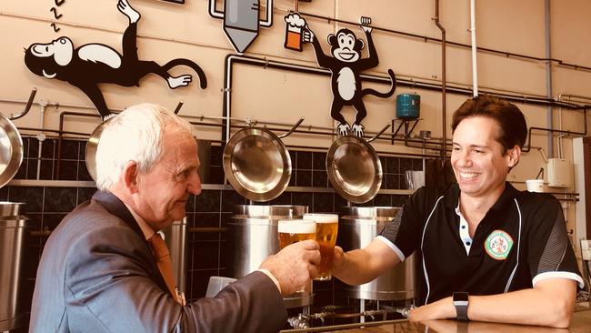 Logan councillor Russell Lutton and Monkey Tree Brewing director Dean Forte raise a glass to relaxing the industry thresholds in Logan.