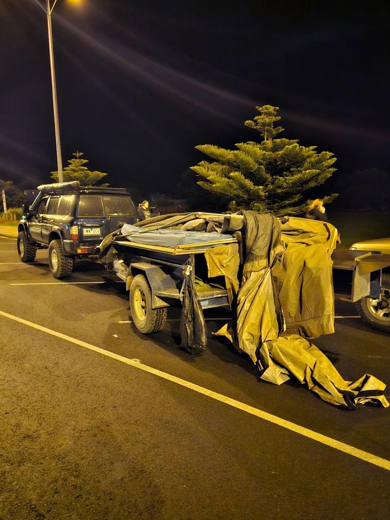 Mr Momcelivic’s car and camper trailer after the incident. The couple’s camping gear was scattered along the Great Ocean Road after the incident. Picture: Supplied