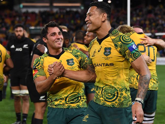 Wallabies players Nick Phipps (left) and Israel Folau celebrate their win in the Rugby Championship, Bledisloe Cup match between the Australian Wallabies and the New Zealand All Blacks at Suncorp Stadium last year.