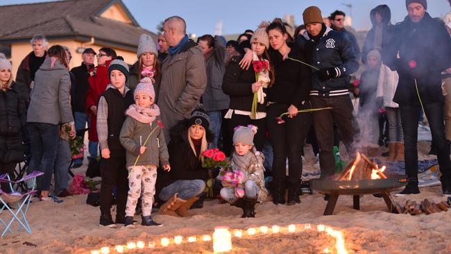 Family, friends and wellwishers gathered at Freshwater Beach to remember Justine Ruszczyk her in a sunrise vigil on the anniversary of her death. Picture: AAP IMAGE/Troy Snook