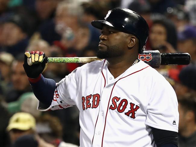 (FILES) In this file photo taken on October 10, 2016 David Ortiz #34 of the Boston Red Sox looks on in the eighth inning against the Cleveland Indians during game three of the American League Divison Series at Fenway Park in Boston, Massachusetts. - Three time World Series champion David Ortiz was shot and wounded late June 9, 2019 at an amusement center in his native Dominican Republic, media reported.Ortiz was shot in the back by a motorcyclist and "the bullet went through his stomach," Dominican National Police spokesman Felix Duran Mejia told CNN.Ortiz, 43 was taken to a hospital in nearby Santo Domingo where he underwent surgery. (Photo by ELSA / GETTY IMAGES NORTH AMERICA / AFP)