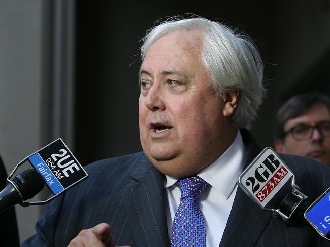 Senator Bill Heffernan looks on as Clive Palmer holds a press conference at Parliament House in Canberra.