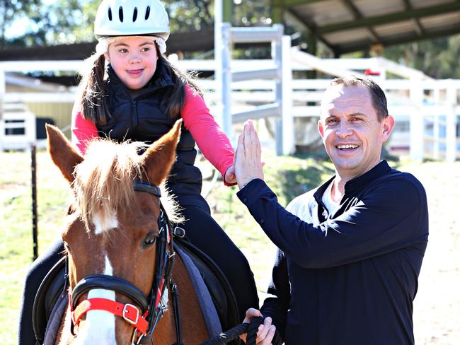 Top Australian racehorse trainer Chris Waller flies to Brisbane to make donation to Pony Riding for the Disabled Association (PRDA) , he leads Neve 8yrs with horse called Rosie. Pic Annette Dew