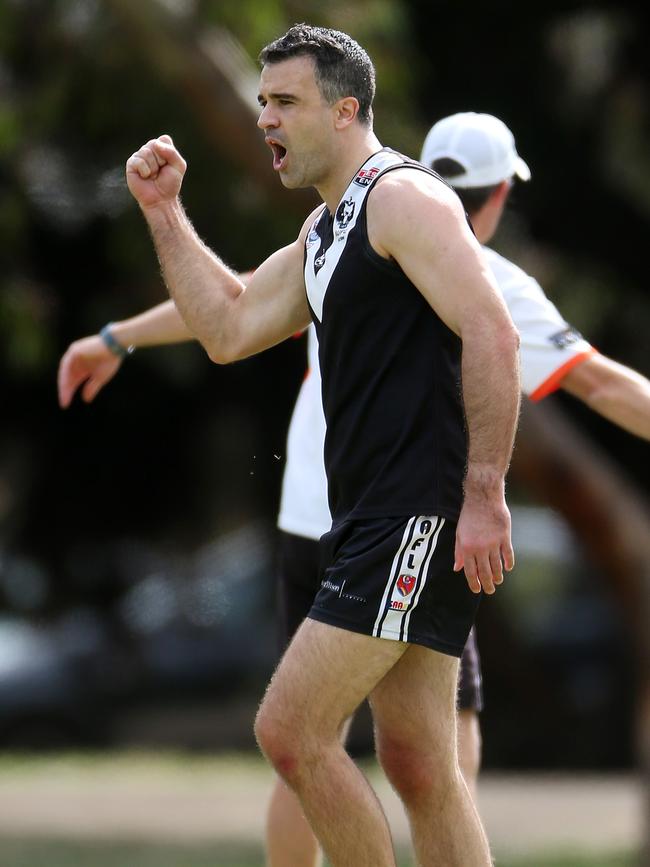 Opposition Leader Peter Malinauskas celebrates kicking a goal for the Blacks in a match in 2016. Picture: Calum Robertson.