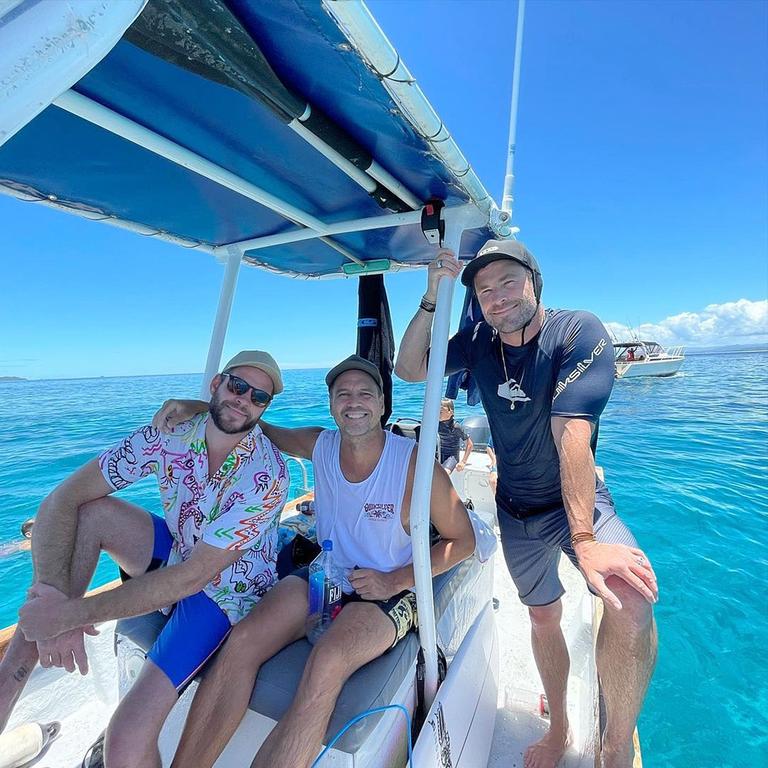 Luke Munro (centre) with Liam Hemsworth and Chris Hemsworth at Tavarua Island. Source: Instagram