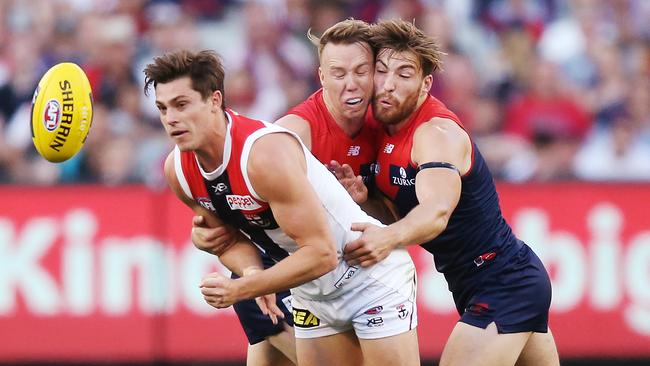 Jack Viney collides with teammate James Harmes while attempting to tackle St Kilda’s Jack Steele.