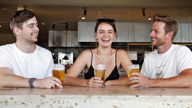 DAILY TELEGRAPH - 1/11/24Drinkers at Felons Brewing Co - Manly, L to R, Lachlan Mason-Cox, Taylor Vermilyea and Murray Smith (0423043962) enjoy a Friday afternoon beer.  Picture: Sam Ruttyn