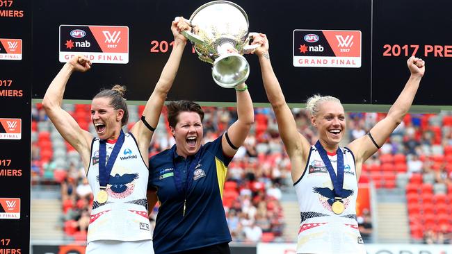 Adelaide Crows players Chelsea Randall and Erin Phillips celebrate AFLW Grand Final with coach Bec Goddard, who will return to coach the team in 2018. (Pic: Adam Head)