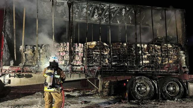 Firefighters work to make the crash scene safe.