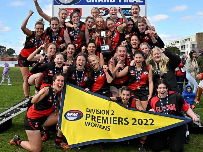 Eltham players celebrate after the NFL football womenÃs D2 grand final between Eltham and St Mary's at Preston City Oval in Preston, Sunday, Aug. 21, 2022. Picture: Andy Brownbill