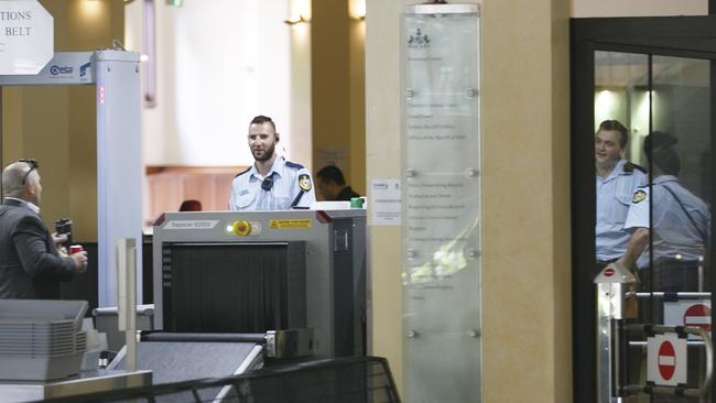 Security guards working at Downing Centre court complex, Sydney. Picture: Tim Pascoe