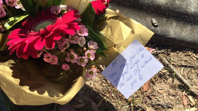 Flowers left at the site where Tara Brown was run off the road at Molendinar. Picture: Lexie Cartwright