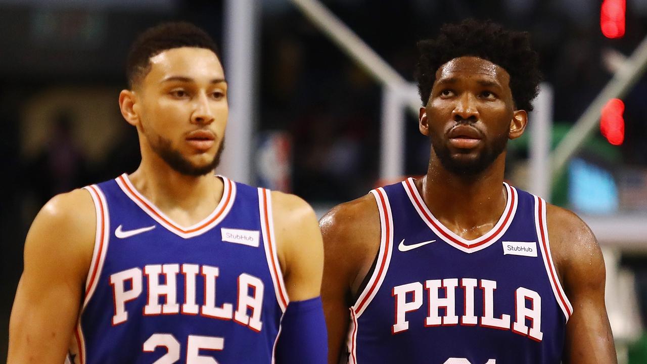 BOSTON, MA - JANUARY 18: Ben Simmons #25 and Joel Embiid #21 of the Philadelphia 76ers walk off the court during a time out in the second half against the Boston Celtics at TD Garden on January 18, 2018 in Boston, Massachusetts. Tim Bradbury/Getty Images/AFP == FOR NEWSPAPERS, INTERNET, TELCOS &amp; TELEVISION USE ONLY ==