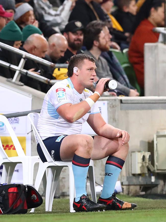 Angus Bell watches from the sidelines after being sent off. Picture: Kelly Defina/Getty Images