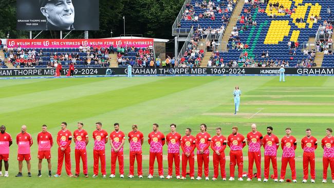 Match officials and players in The Hundred competition observe a minute's silence in tribute to Graham Thorpe in Cardiff, Wales. Picture: Dan Istitene/Getty Images