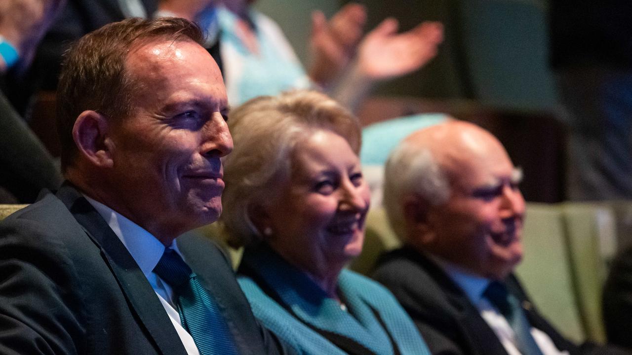 Tony Abbott, Janette and John Howard yesterday. Picture: Jason Edwards