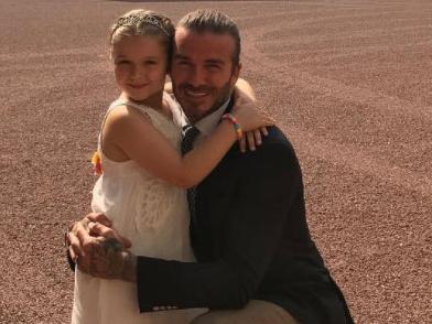 David Beckham and daughter Harper outside Buckingham Palace.