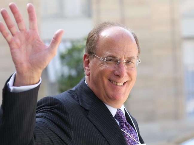 (FILES) In this file photo taken on July 10, 2019, Chairman and CEO of BlackRock, Larry Fink waves as he leaves a meeting about climate action investments at the Elysee Palace in Paris. - BlackRock, sometimes called the most powerful company you have never heard of, has grown exponentially since its founding in 1988, especially since the 2008 financial crisis.  The company has been seen as a shadowy potential beneficiary of the French government's controversial pension system changes by critics of French President Emmanuel Macron. (Photo by Ludovic MARIN / AFP)