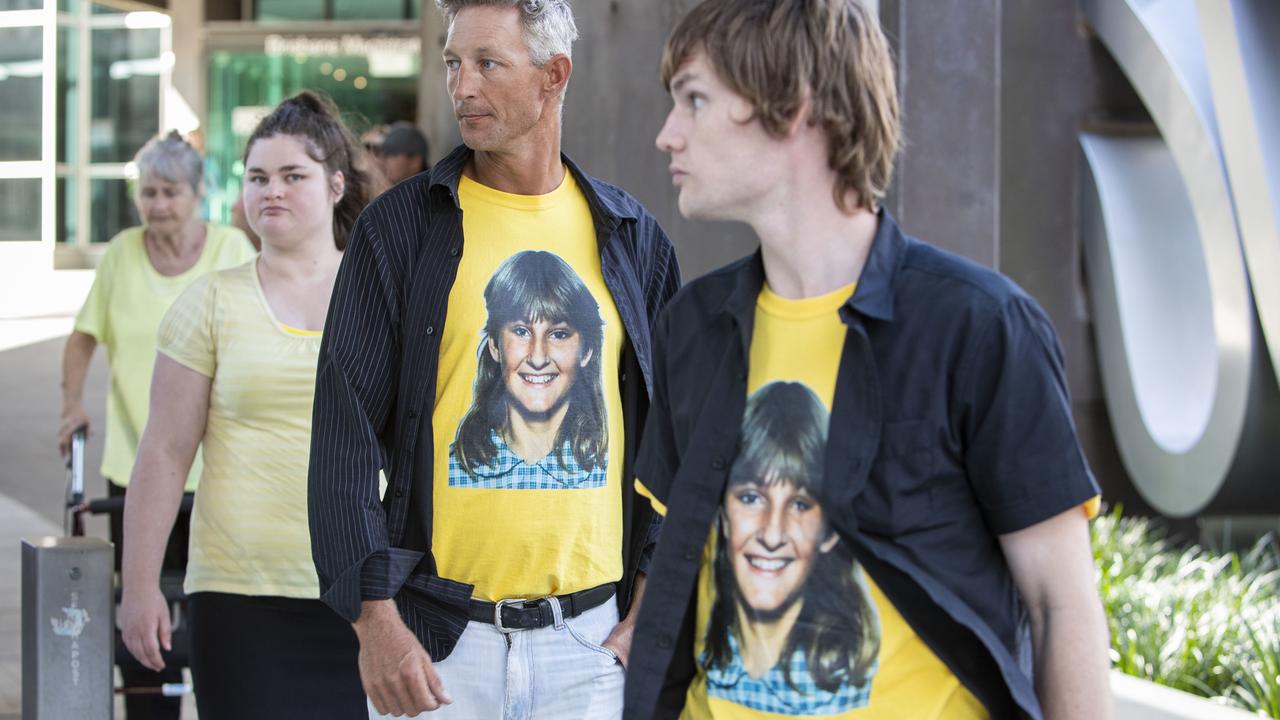 A t-shirt displaying a photograph of Toowoomba teenage victim Annette Mason is worn by family members outside the Brisbane Coroners Court.