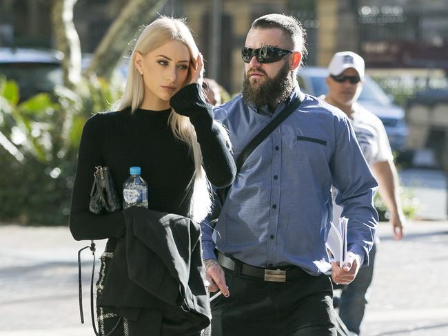 Nomads national president Dylan Brittliffe arrives at court with an unidentified woman as part of a recent legal fight against new police powers curtailing bikie movements.